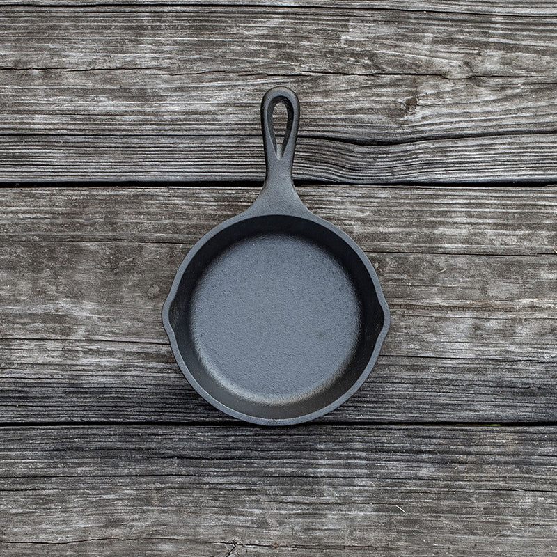 The 5-inch Mini Skillet brings a touch of charm to single-serve cooking, perfect for eggs, desserts, and more. Crafted in the USA from iron and oil, it features a naturally seasoned surface for easy food release and simple cleaning.