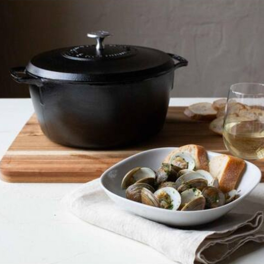 The Blacklock Triple Seasoned 5.5Qt Dutch Oven, crafted by Lodge, America's oldest family-owned cast iron cookware foundry, brings over a century of craftsmanship to your kitchen. Triple seasoned for a natural, nonstick finish and easy cleanup, this lightweight Dutch oven heats evenly at lower temperatures, making it perfect for searing and browning.