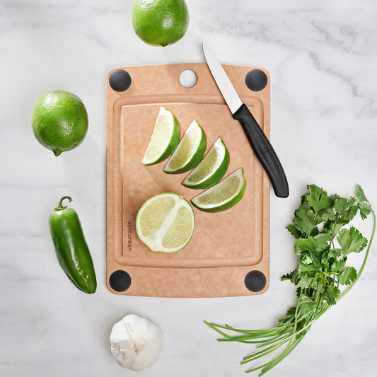 Small but mighty, the Epicurean All-in-One Cutting Board (10" x 7") packs performance into a compact size. With a built-in juice groove on one side and a flat surface on the other, this dual-sided board adapts to any task