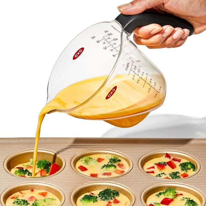 No more awkward neck-craning to check measurements! The OXO Good Grips 2-Cup Angled Measuring Cup is your kitchen superhero, making everything from fancy cocktails to zesty dressings a breeze. The genius is in the design—just peek down into the cup to read measurements instantly!