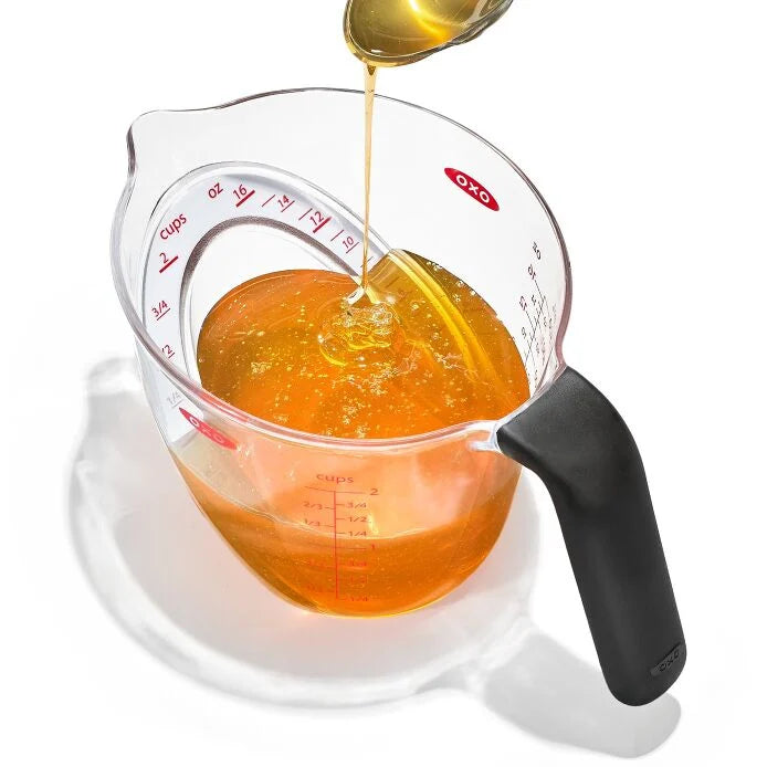 No more awkward neck-craning to check measurements! The OXO Good Grips 2-Cup Angled Measuring Cup is your kitchen superhero, making everything from fancy cocktails to zesty dressings a breeze. The genius is in the design—just peek down into the cup to read measurements instantly!