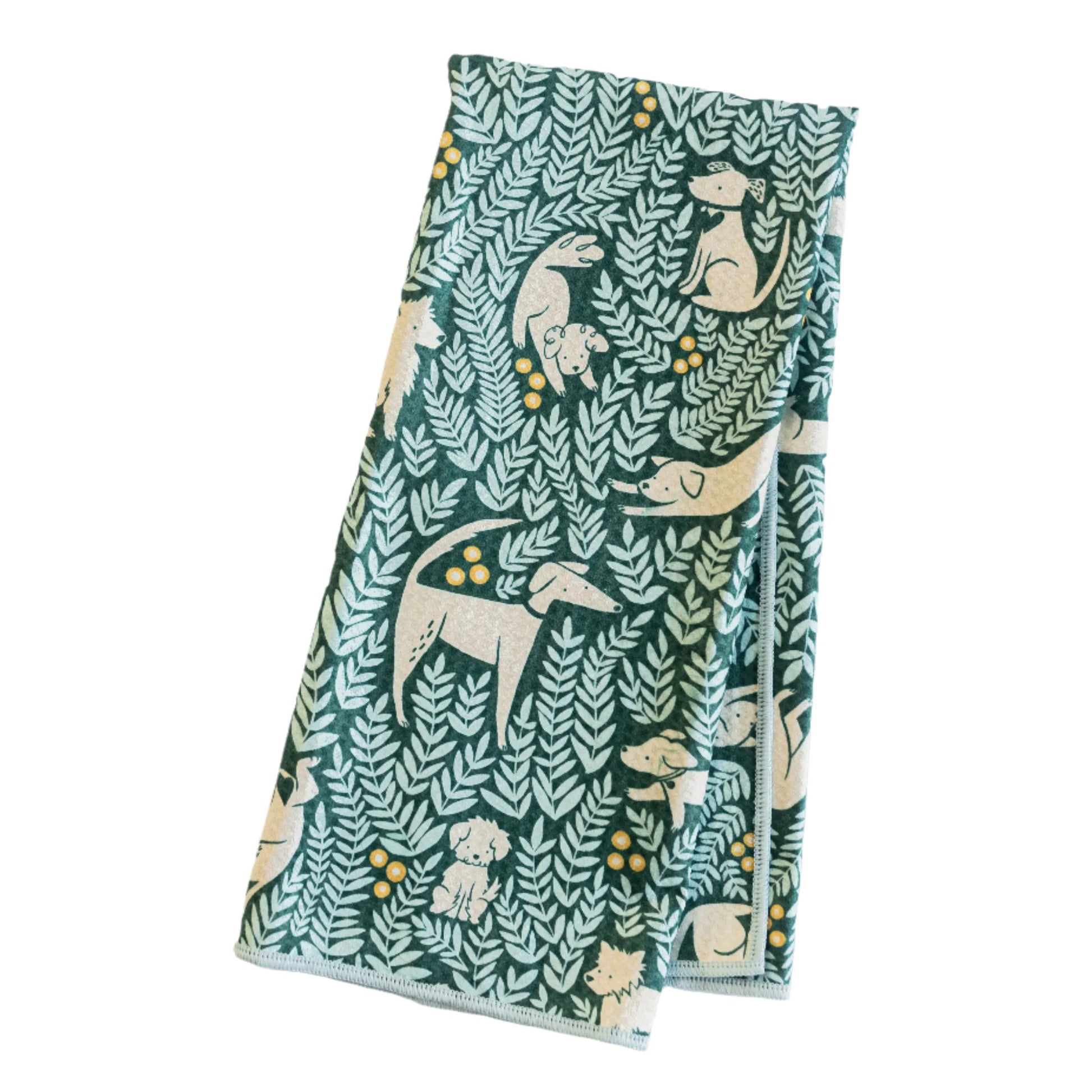 Calling all dog lovers! Get ready to wag your tails with excitement over the Dog Park Print Towel Collection. The lush teal ground print with pops of yellow is adorned with playful pups, giving your home a burst of energy and happiness. The reverse is an inspirational bold leaf print on a sunny yellow ground.
