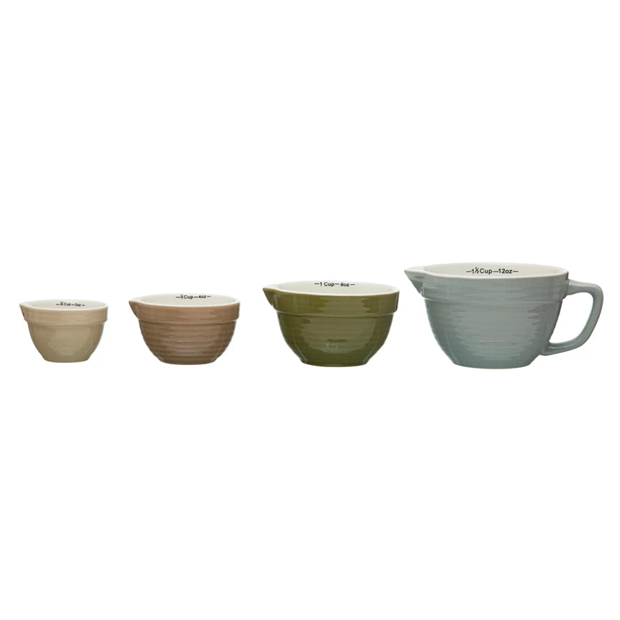 Add charm and functionality to your kitchen with this Set of 4 Batter Bowl Measuring Cups, crafted from durable stoneware in a variety of versatile hues. Designed to resemble classic batter bowls, each cup features an easy-pour spout and a sturdy handle for effortless measuring and pouring of wet or dry ingredients.