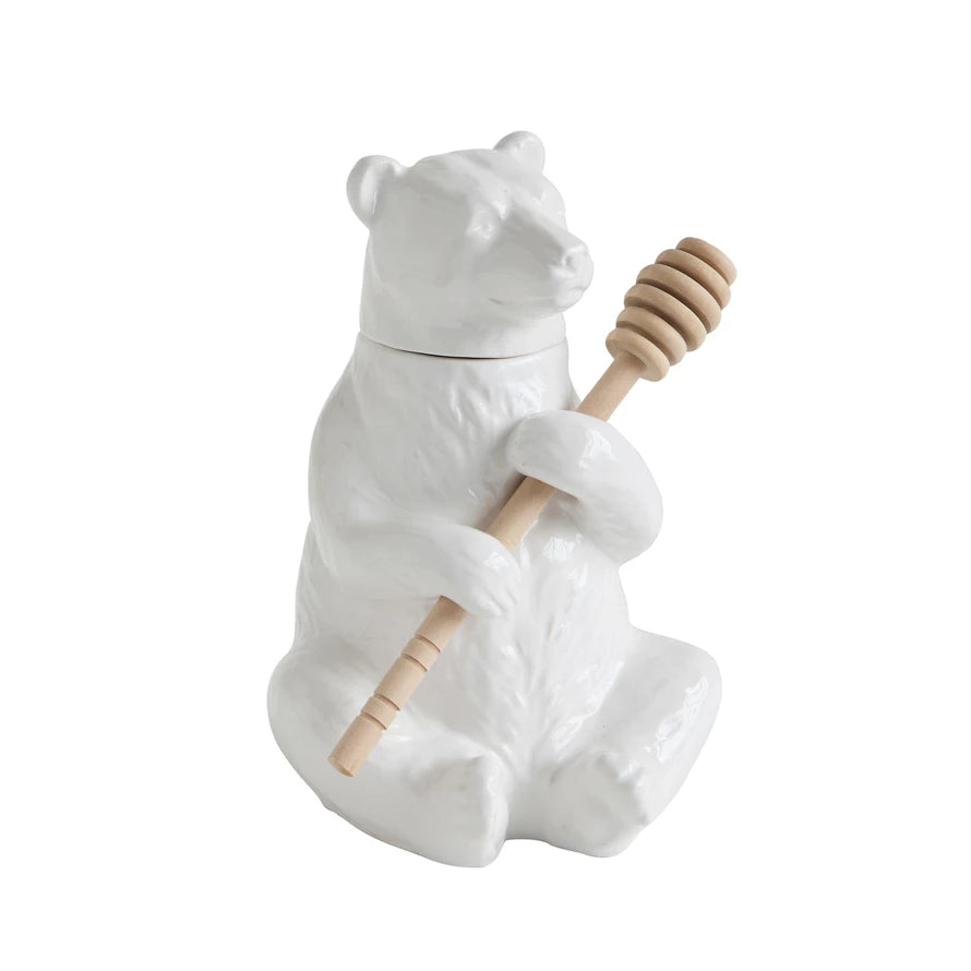 Honey should be served in this white bear shaped pot. Our friendly bear is holding the bamboo dipper until it is needed again. This honey pot can be left out in the kitchen as part of its decor.