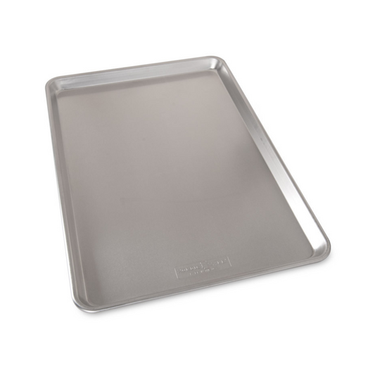 Make large batches of cookies and bars with this extra large sheet pan. Fits most standard size ovens. 35% larger surface than the half sheet! The Nordic Ware commercial-duty Naturals® Bakeware is made of even-heating, rust-proof aluminum and features a galvanized steel encapsulated reinforcement around the rims for added strength.