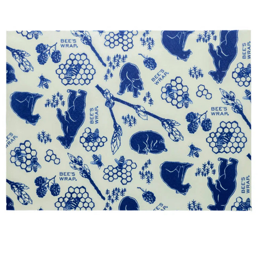 Bees wrap with blue bear and honeycomb pattern on a white background