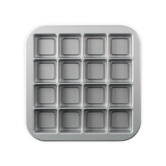 Nordic Ware Brownie Bites Pan makes sixteen tasty, crispy on the outside, and fudgy on the inside, brownies. Every bite is brownie bliss. The cast aluminum bakeware provides fine details and superior baking performance. The heat reflective exteriors allows for uniform browning so as to enhance the unique design. Non-stick finish for easy cleaning. Proudly made in the USA by Nordic Ware. They're the perfect size for sharing (or not)! Get ready for everyone to start fighting over the last brownie.