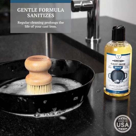 Clark's Cast iron soap on counter with a cast iron skillet and scrub brush being washed.