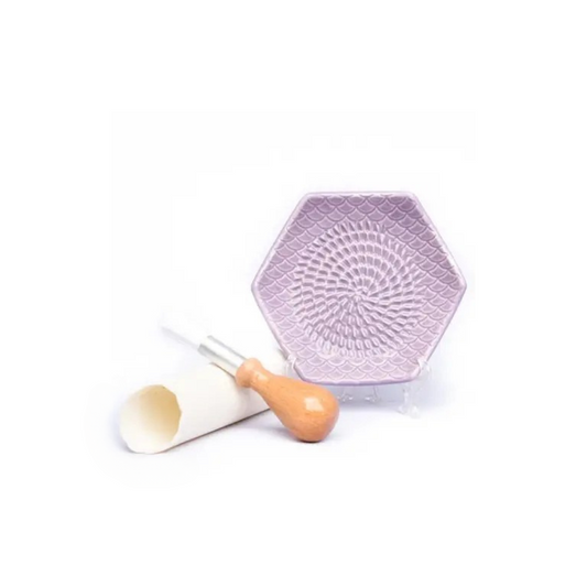 The Grate Plate is a ceramic grating plate used to grate garlic, ginger, peppers, nutmeg, chocolate, hard cheeses and much more! Perfect for adding fresh flavor to any dish. It's easy to clean and can be reused for an endless variety of culinary creations. Plus, the handy silicone garlic peeler and gathering brush make prepping fast and mess-free!