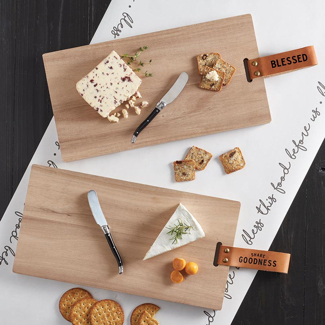 Our Charcuterie Plank Board - "Share Goodness", crafted from classic acacia wood to beautifully present the food you love sharing with friends and family. This versatile board doubles as a cutting surface, making it perfect for preparing and serving a variety of cheeses, meats, fruits, and more. Its natural wood grain and sturdy construction ensure durability and a stylish addition to your table.