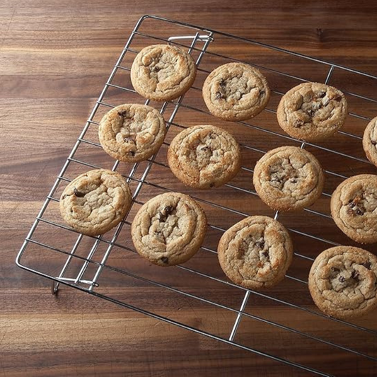A baker's essential. End the baking process profoundly by placing your fresh-out-of-the-oven cookies, cakes, and breads on these Stackable Cooling Racks. Made of durable, lightweight chrome, this set includes 3 stackable cooling grids, which will elevate your baked goods for uniform cooling and nice, crisp undersides. Perfect when baking a large amount of cookies or when counter space is limited.