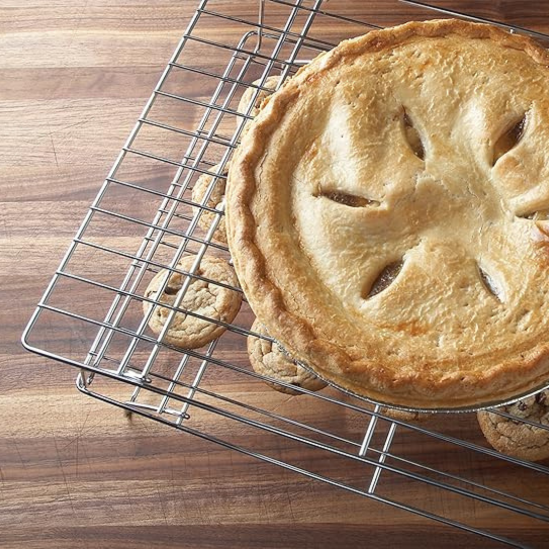A baker's essential. End the baking process profoundly by placing your fresh-out-of-the-oven cookies, cakes, and breads on these Stackable Cooling Racks. Made of durable, lightweight chrome, this set includes 3 stackable cooling grids, which will elevate your baked goods for uniform cooling and nice, crisp undersides. Perfect when baking a large amount of cookies or when counter space is limited.