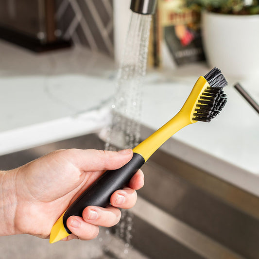 This specialized brush is designed to tackle cooked-on food in tight spaces, such as corners, grooves, and between grill ribs. Featuring dual narrow brush heads for precise cleaning and a pointed handle for effective scraping, it’s crafted from durable molded plastic with a no-slip silicone grip for effortless maneuverability.