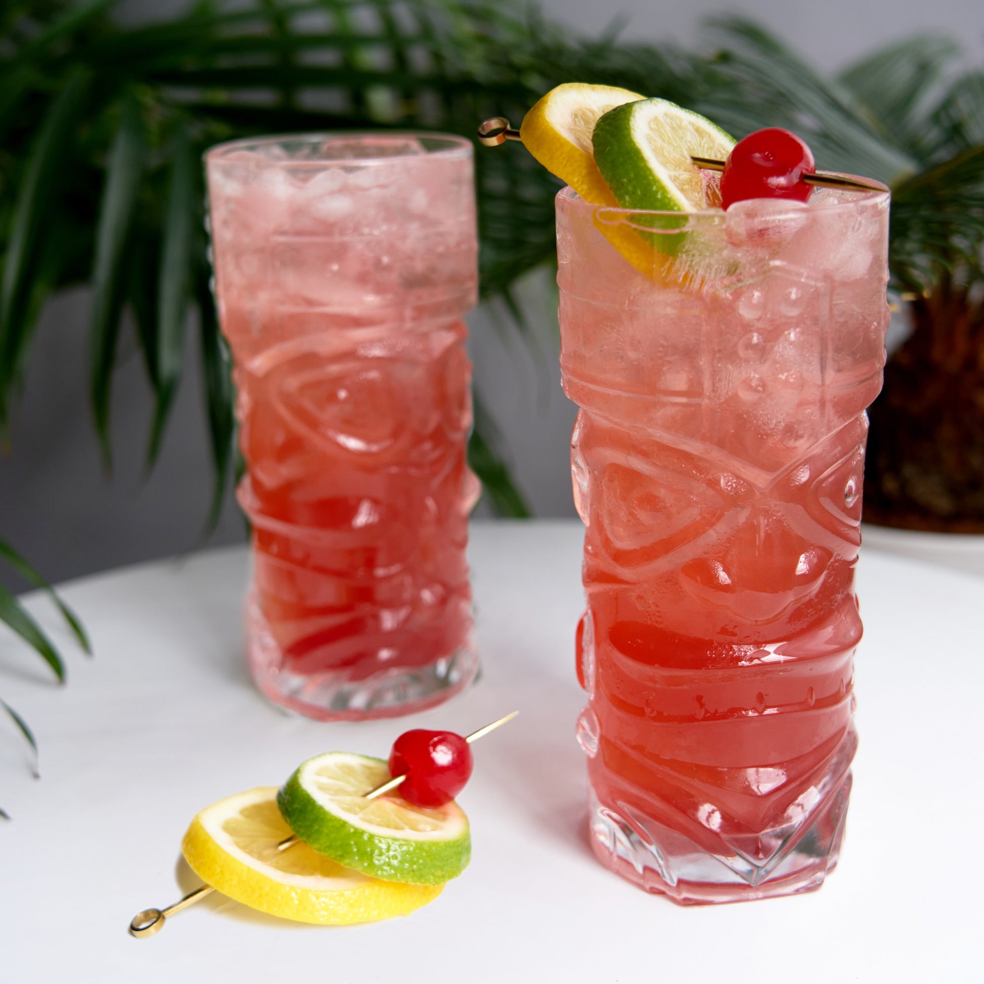 Take tiki to the next level. Tropical cocktails are positively luminous in these glasses, evoking the lush vibrancy that tiki drinks are known for. Enjoy with classics like the iconic Mai Tai, or mix up something new and trendy. This set is suitable for any cocktail you would serve in a large highball glass. With an ideal weight and feel, this set of ornate cocktail glasses feels as good in your hand as they look on your bar.