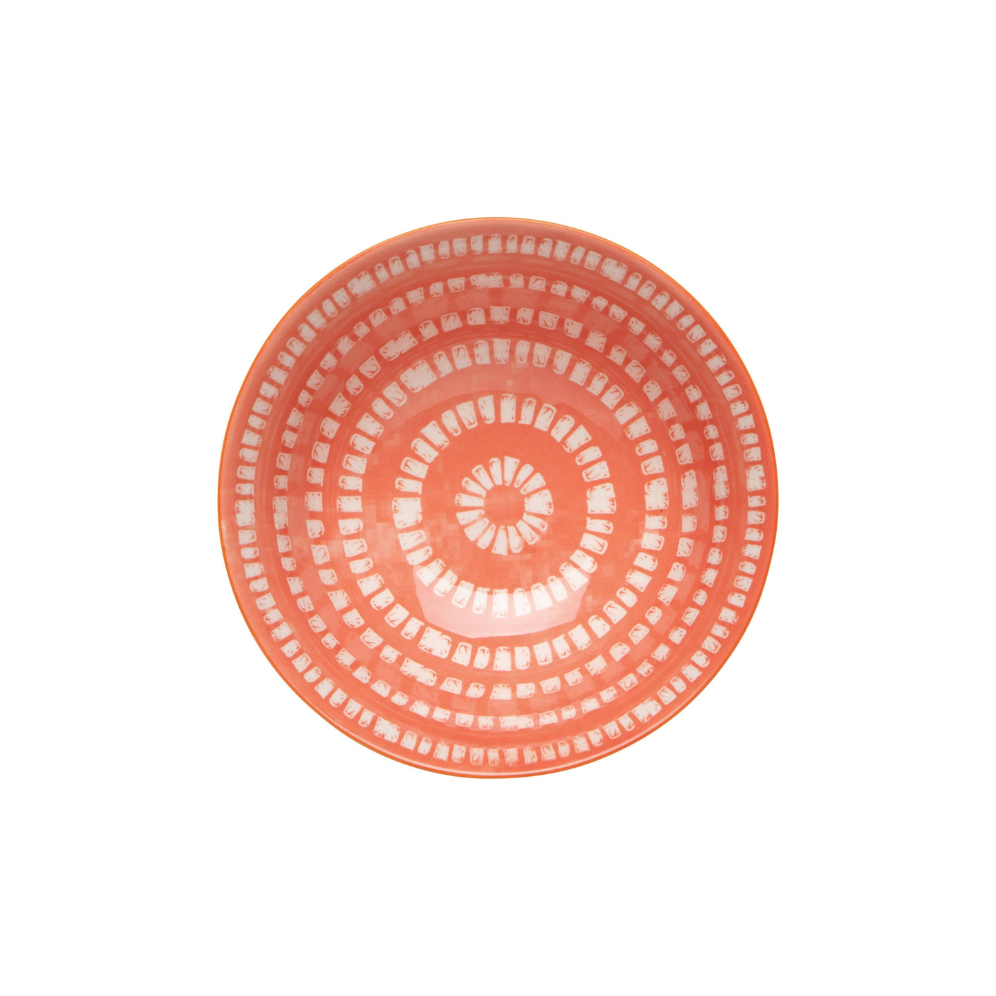 Coral-colored plate with a circular pattern on a white background