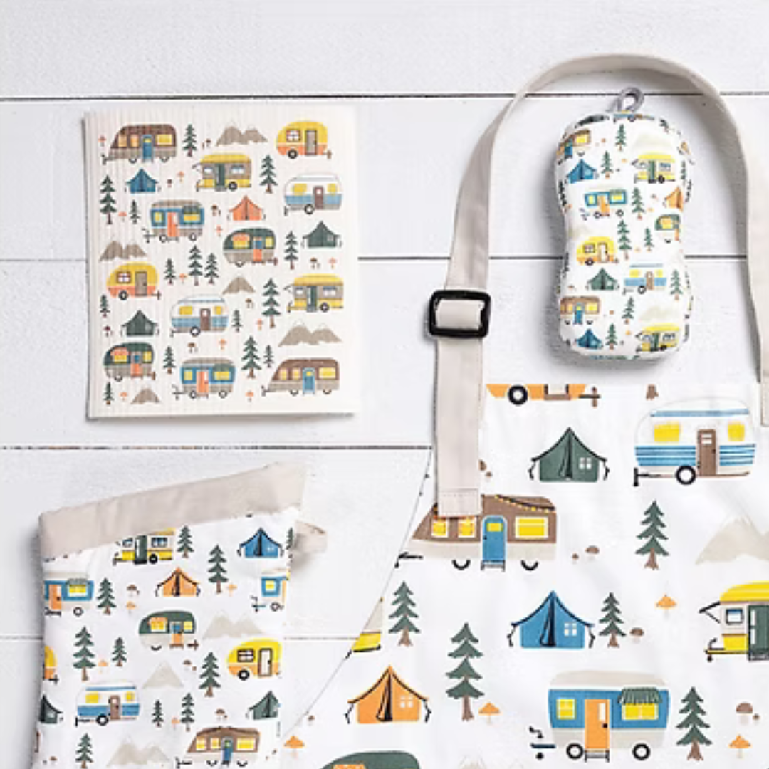 Bring a little adventure to your kitchen with the Designer Chef Apron in Happy Campers. Featuring a playful, outdoorsy print and the same beloved fit as our Classic Chef Apron, this cotton twill essential is made for cooks who crave comfort, durability, and just the right amount of charm. Whether you're flipping pancakes or roasting marshmallows at home, you'll be ready for the task—no campfire required.