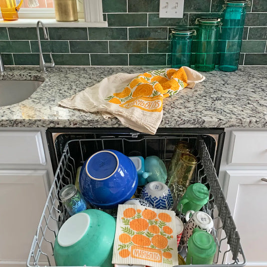 Our Marigolds tea towel is sure to freshen up your kitchen and brighten your everyday. Made from 100% flour sack cotton, our Marigolds dish towel and will only get softer and more absorbent over the years in your kitchen. This generously sized dish towel can handle small and big tasks in the kitchen as well as household chores.