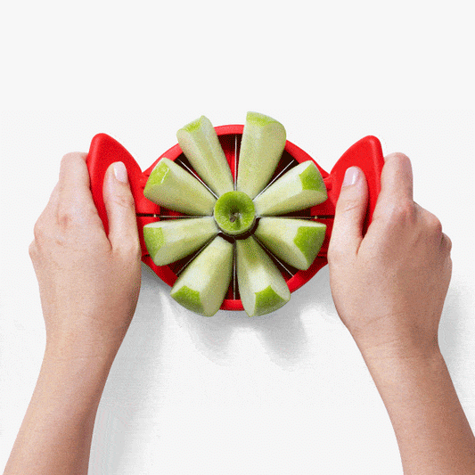 Flapple – the ultra-sharp apple slicer and corer that folds flat for easy storage. Its raised handles fold down for a compact, space-saving solution. The auto-aligning base allows for complete cuts without a cutting board, and when folded, the handles lock together to cover the blades for safe storage. With a wide diameter cutter, Flapple divides apples of all sizes into 8 equal pieces while efficiently removing the core.