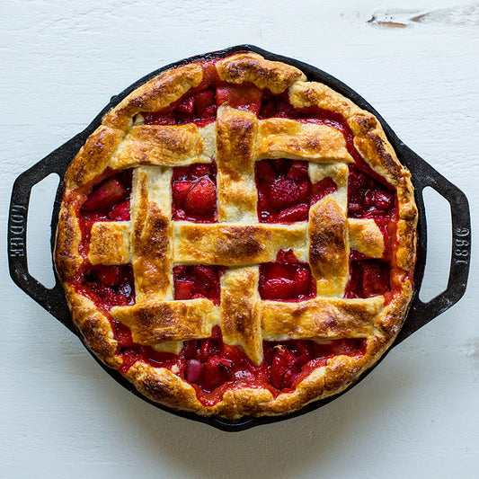 this dual-handle skillet is a kitchen essential designed for versatility and ease. Its naturally seasoned surface, ready to use, ensures easy food release while providing excellent heat distribution and retention for consistent, even cooking.