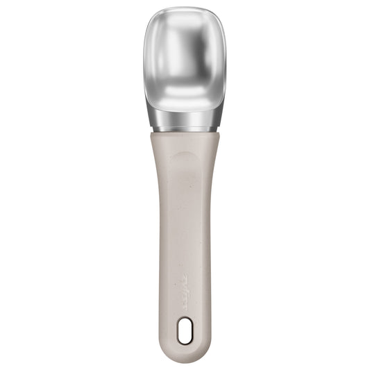 Ice cream scoop with metallic head and beige handle on a white background