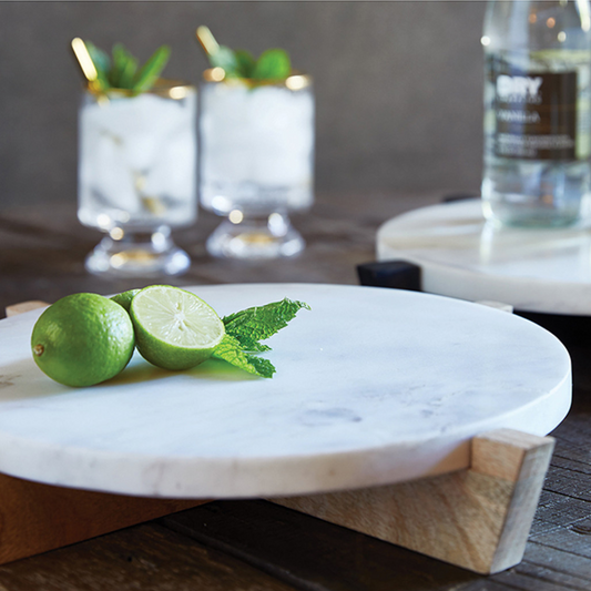 Marble and mango wood pair well just like cheese and wine! Serve your favorite cheeses and appetizers on this beautiful marble board. Mango wood stand is removeable. Perfect centerpiece for parties and beverage tastings.