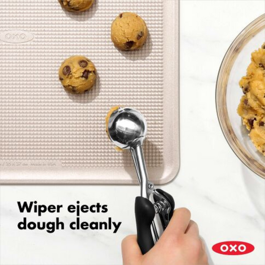 Say hello to cookie perfection with our Medium Cookie Scoop! This nifty size 40 portioner is your ticket to cookie consistency heaven, dishing out exactly 1.5 tablespoons of dough with each scoop.