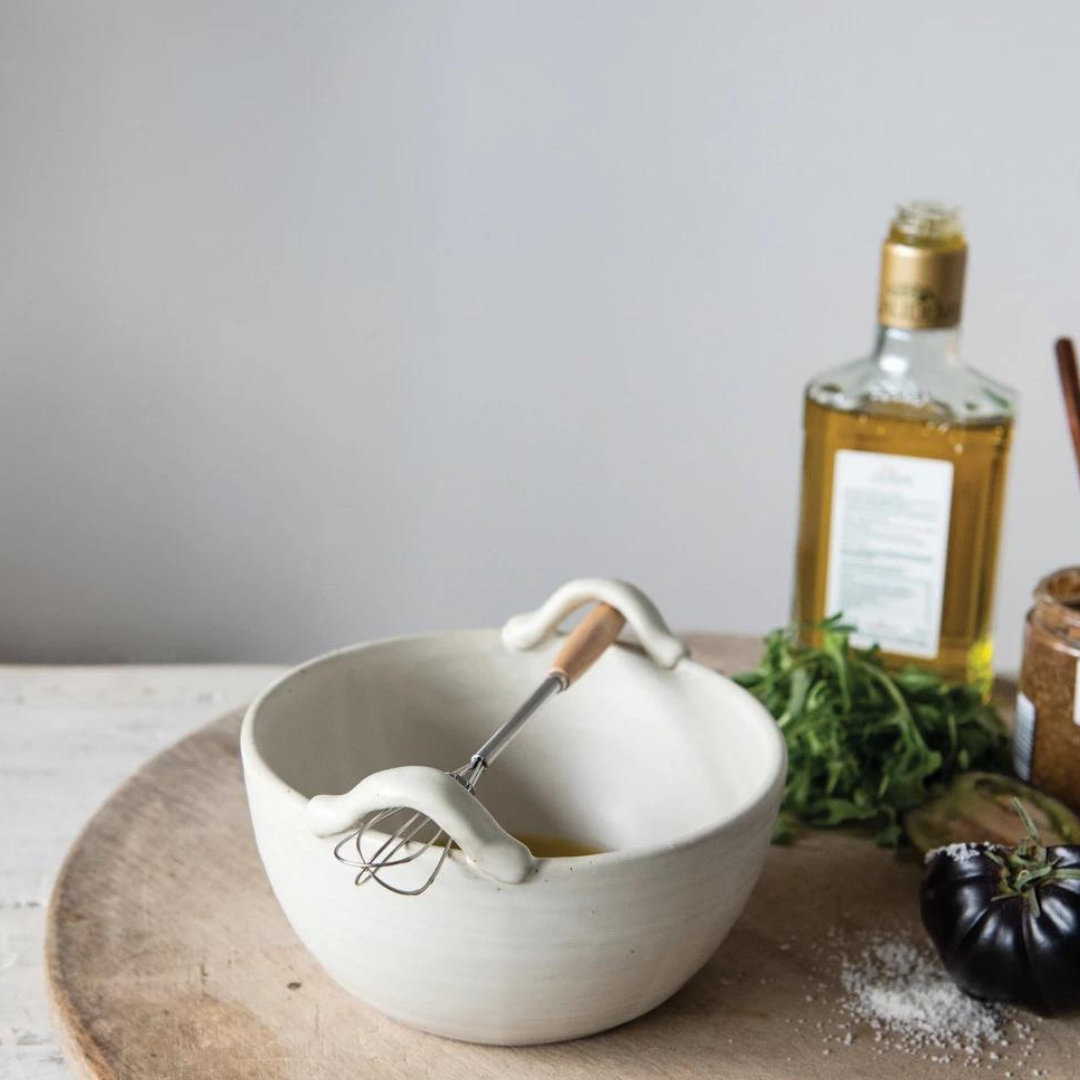 Whisk and Stoneware Mixing Bowl by Creative Co-Op on table