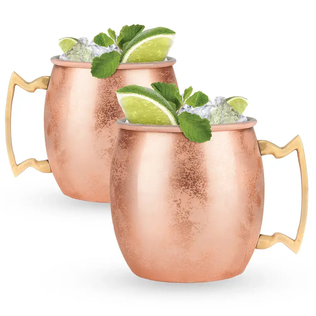 Featuring a durable stainless steel interior and a polished copper finish, these mugs offer a vintage-inspired aesthetic with an intricate brass zig-zag handle. Perfect for adding a touch of classic charm to any bar cart.