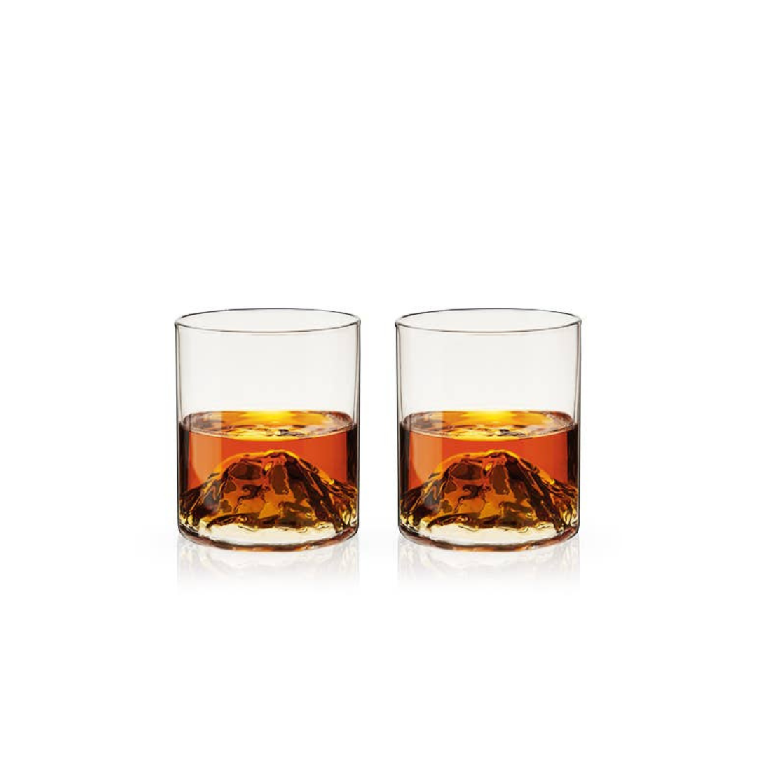 Experience the artistry of nature with these stunning crystal tumblers, featuring hand-blown, dimensional mountains rising from the base—an homage to the majestic peaks of the Pacific Northwest. As you swirl your favorite liquor, watch it cascade around the rugged landscape within your glass. Each handmade piece is unique, with slight variations that add to its charm.
