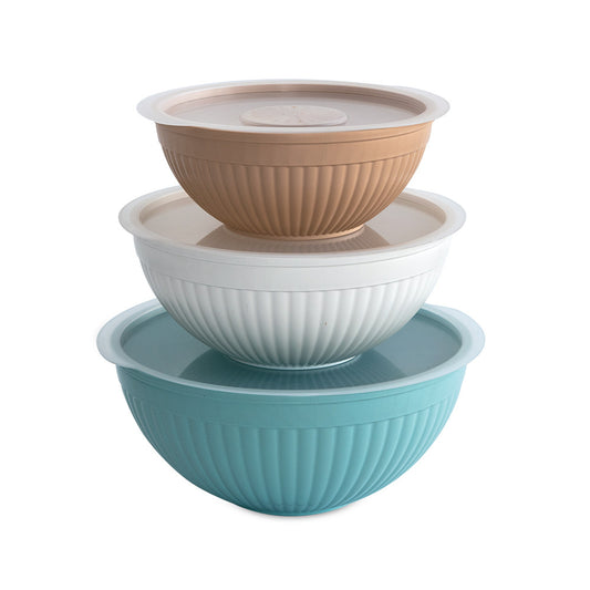 Set of three mixing bowls in brown, white, and blue on a white background