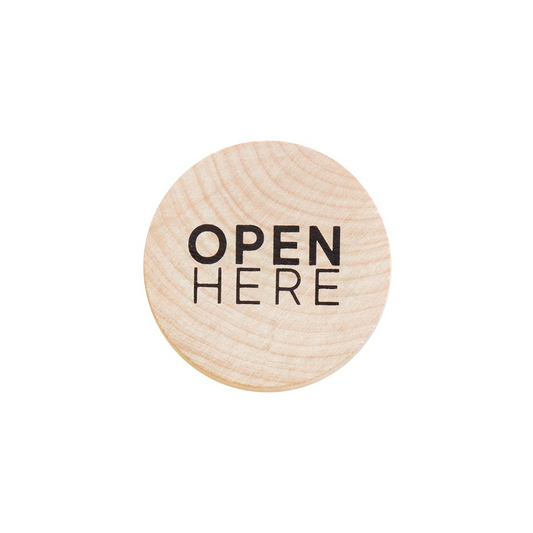 Introducing our Beech Wood Bottle Opener, boldly emblazoned with "Open Here." This essential accessory ensures you can crack open your favorite drink with ease and style. Its practical yet playful design makes it a perfect gift for any occasion. Conveniently stick it on your refrigerator for quick access, ensuring it's always at hand when you're ready to pop open a refreshing beverage.