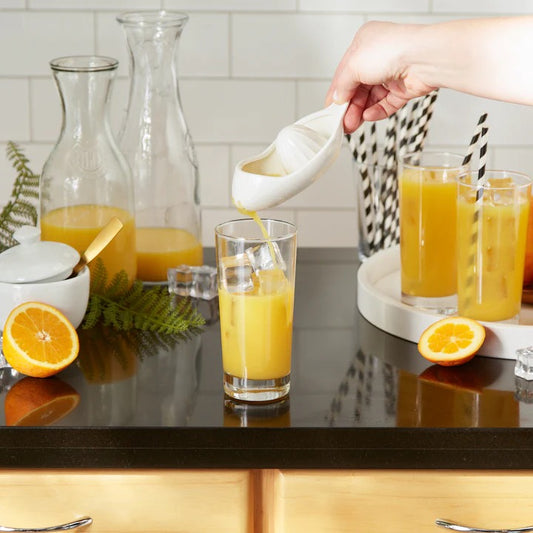 The Porcelain Citrus Juicer is made of white porcelain with polished looks whether in use or not. Our slipper-shaped juicer is a novel way to extract the juice from lemons, limes and other small citrus fruits. Sturdy design keeps strainer in place strain seeds and pulp as you pour. No more squeezing by hand and making a sticky mess! Make extracting juice a cinch and add a touch of citrus-y flair to your kitchen.