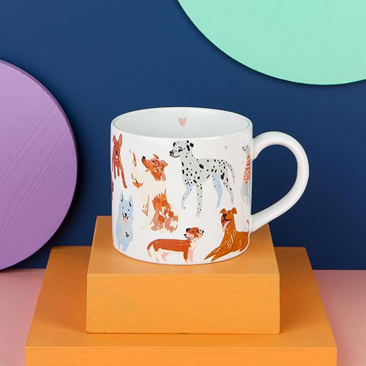 "Puppos" Mug in a Box! This mug is paws-itively adorable, featuring a playful pack of different dog breeds on the outside and a smooth white inside.
