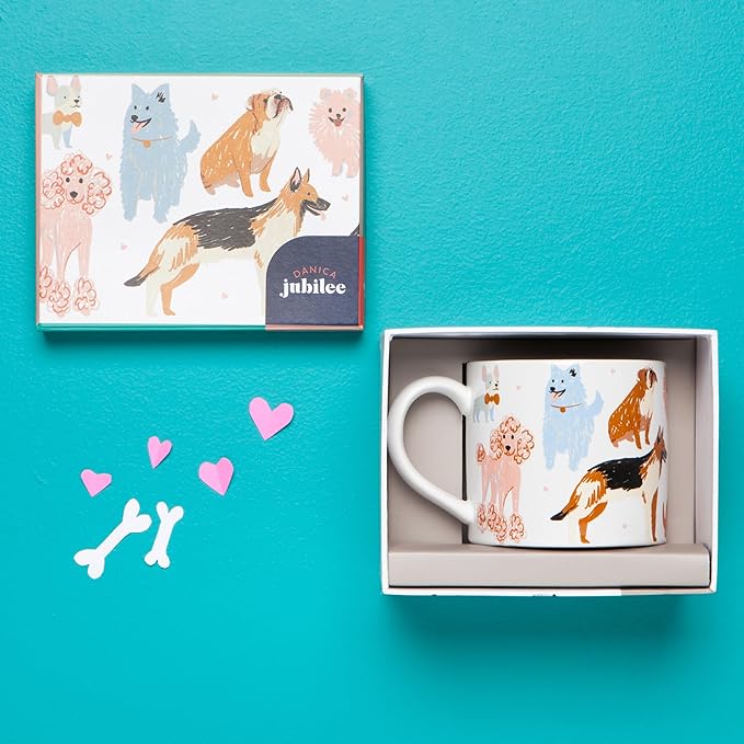 "Puppos" Mug in a Box! This mug is paws-itively adorable, featuring a playful pack of different dog breeds on the outside and a smooth white inside.