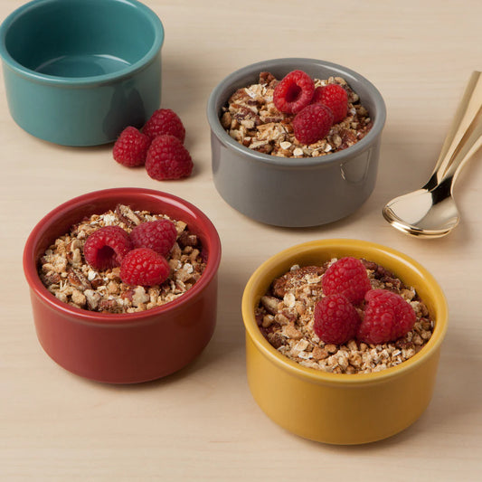 Set of 4 stoneware ramekins are 6 ounces in capacity. Made by Now Design, these red, blue, yellow, and grey ramekins are dishwasher and microwave safe!