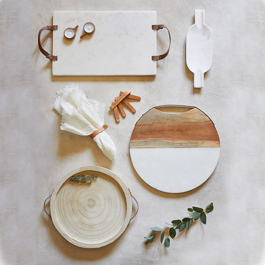 Host in style with this sophisticated Marble and Leather Serving Board. Designed for showcasing cheeses, appetizers, and charcuterie, it’s the perfect centerpiece for parties or wine nights. The combination of sleek marble and sturdy leather handles blends elegance with functionality, making it a must-have for entertaining.
