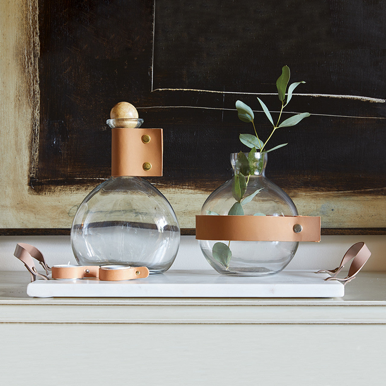 Host in style with this sophisticated Marble and Leather Serving Board. Designed for showcasing cheeses, appetizers, and charcuterie, it’s the perfect centerpiece for parties or wine nights. The combination of sleek marble and sturdy leather handles blends elegance with functionality, making it a must-have for entertaining.