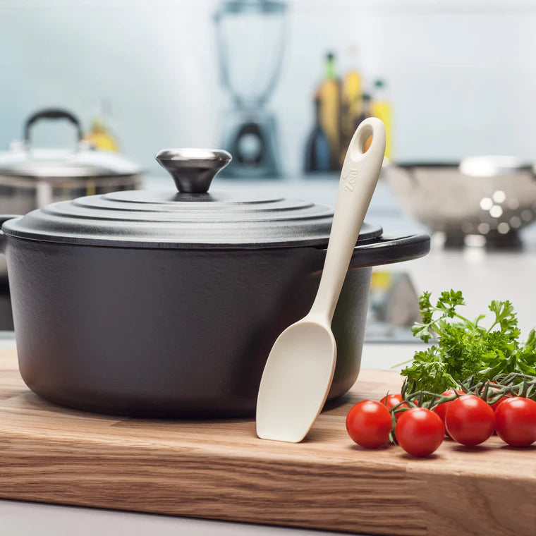 Meet your new kitchen essential—the Silicone Spoonula in Coastal Grey! This clever hybrid of a spoon and spatula is designed for ultimate versatility, making stirring, scraping, mixing, and baking a breeze.