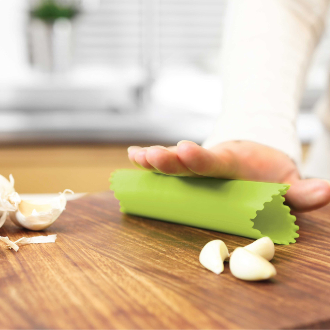 Say goodbye to garlicky fingers with this clever little Garlic Roller! Made from durable, flexible silicone, it effortlessly removes the outer skin from garlic cloves—just pop one inside, press, and roll. The premium design keeps your hands odor-free while making peeling quick and mess-free.