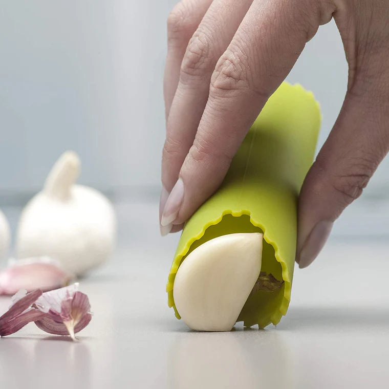 Say goodbye to garlicky fingers with this clever little Garlic Roller! Made from durable, flexible silicone, it effortlessly removes the outer skin from garlic cloves—just pop one inside, press, and roll. The premium design keeps your hands odor-free while making peeling quick and mess-free.