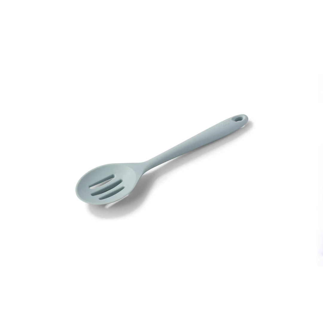 The Silicone Slotted Spoon in Coastal Blue is the ultimate multitasker for your kitchen! Perfect for stirring, straining, and serving, its sculpted head makes cooking effortless. The sturdy nylon core is wrapped in high-quality, non-scratch silicone, keeping your cookware safe while handling high heat up to 482ºF.