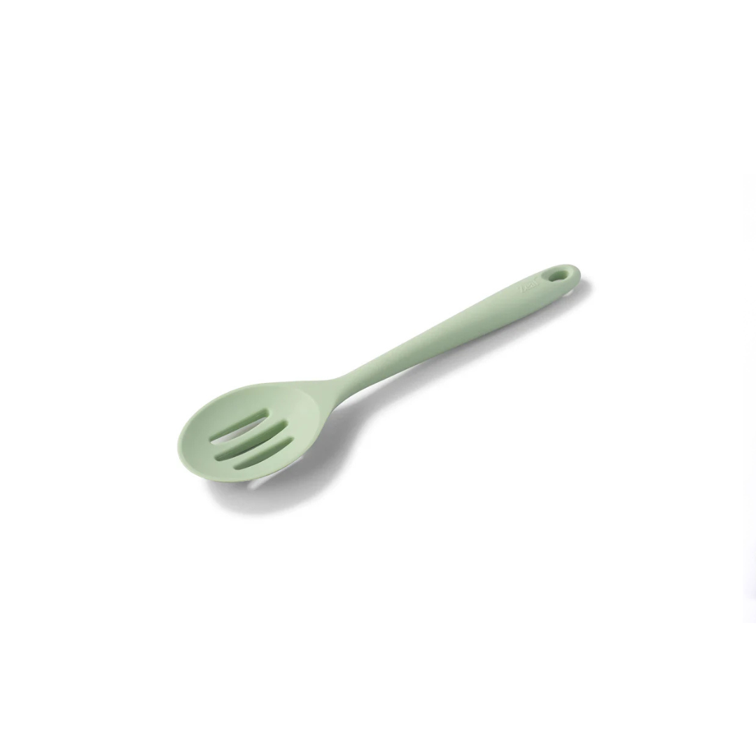 The Silicone Slotted Spoon in Coastal Green is the ultimate multitasker for your kitchen! Perfect for stirring, straining, and serving, its sculpted head makes cooking effortless. The sturdy nylon core is wrapped in high-quality, non-scratch silicone, keeping your cookware safe while handling high heat up to 482ºF.