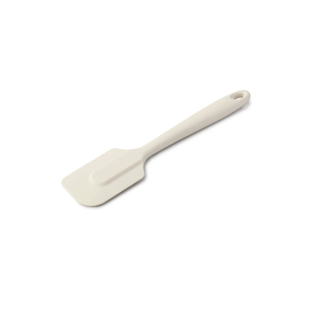 The 10" Coastal Cream Silicone Spatula by Zeal is your go-to kitchen sidekick for stirring, scraping, mixing, and baking with ease. Designed with an ergonomic handle and a handy hanging loop for effortless storage, this spatula features a flexible yet durable non-scratch silicone head that’s safe for all non-stick surfaces.