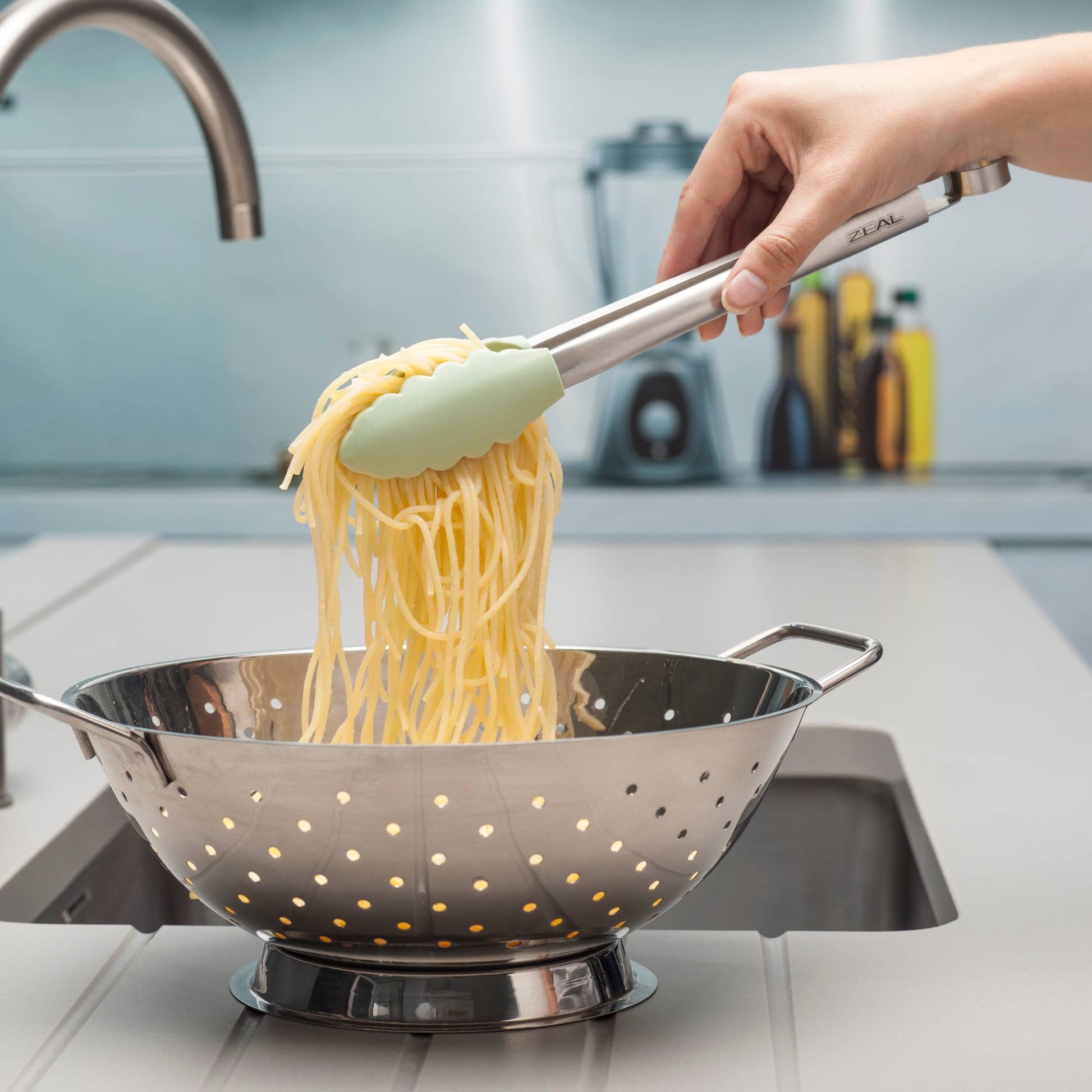 Grip, flip, and serve with ease using the Silicone Tongs in Coastal Green! Featuring scalloped, non-scratch silicone tips, these premium kitchen tongs provide the perfect hold for everything from delicate greens to sizzling steaks. The brushed stainless steel handle offers durability, while the smart locking mechanism keeps them neatly stored when not in use.