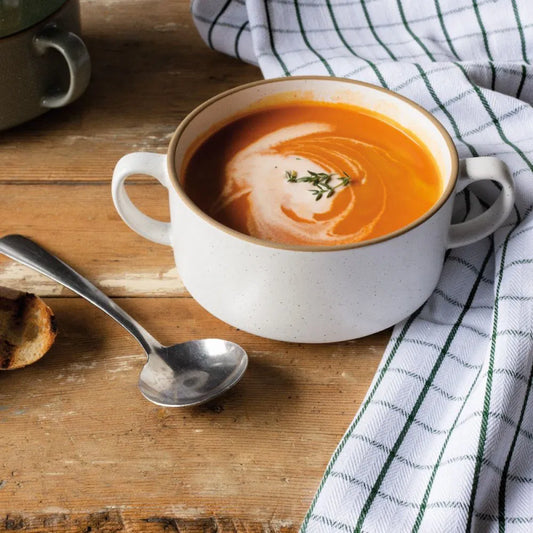 Soup Bowl in classic white! This sleek bowl features convenient side handles that keep your hands cool