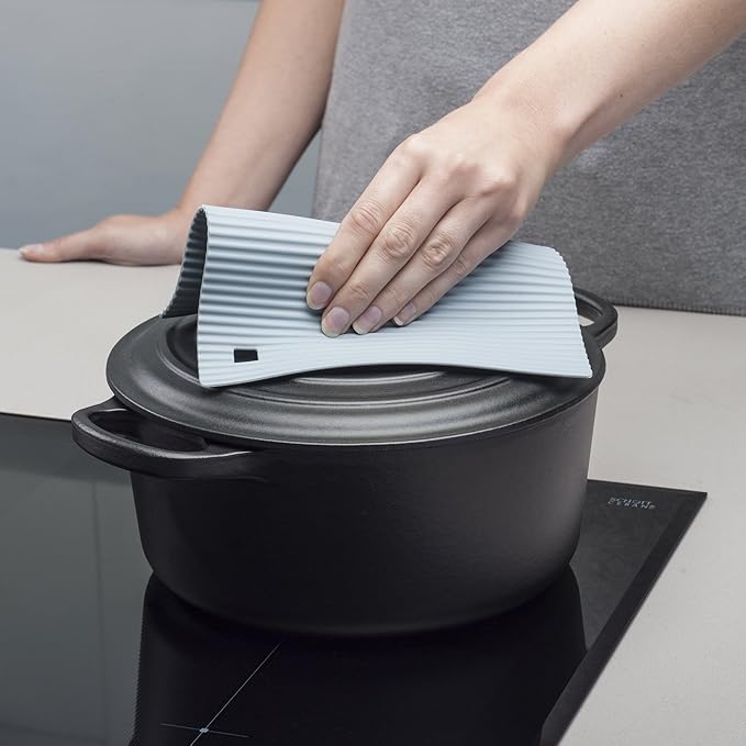 The Zeal Silicone Trivet Mat is the ultimate kitchen multitasker, protecting your countertops and tables from hot pots, pans, and dishes with its non-slip, heat-resistant design (up to 250ºC/482ºF). This 9" x 9" mat isn’t just for hot cookware—it doubles as a potholder, placemat, jar opener, or even a stabilizer for mixing bowls and cutting boards.