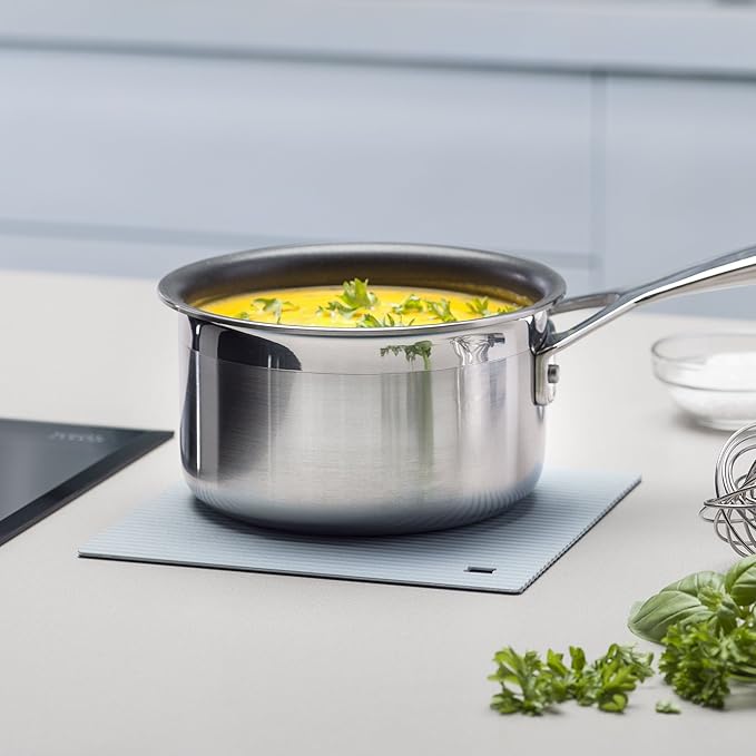 The Zeal Silicone Trivet Mat is the ultimate kitchen multitasker, protecting your countertops and tables from hot pots, pans, and dishes with its non-slip, heat-resistant design (up to 250ºC/482ºF). This 9" x 9" mat isn’t just for hot cookware—it doubles as a potholder, placemat, jar opener, or even a stabilizer for mixing bowls and cutting boards.