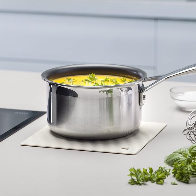 The Zeal Silicone Trivet Mat is the ultimate kitchen multitasker, protecting your countertops and tables from hot pots, pans, and dishes with its non-slip, heat-resistant design (up to 250ºC/482ºF). This 9" x 9" mat isn’t just for hot cookware—it doubles as a potholder, placemat, jar opener, or even a stabilizer for mixing bowls and cutting boards.