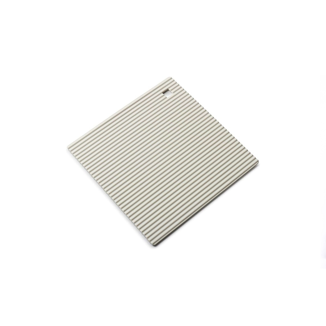 The Zeal Silicone Trivet Mat is the ultimate kitchen multitasker, protecting your countertops and tables from hot pots, pans, and dishes with its non-slip, heat-resistant design (up to 250ºC/482ºF). This 9" x 9" mat isn’t just for hot cookware—it doubles as a potholder, placemat, jar opener, or even a stabilizer for mixing bowls and cutting boards.