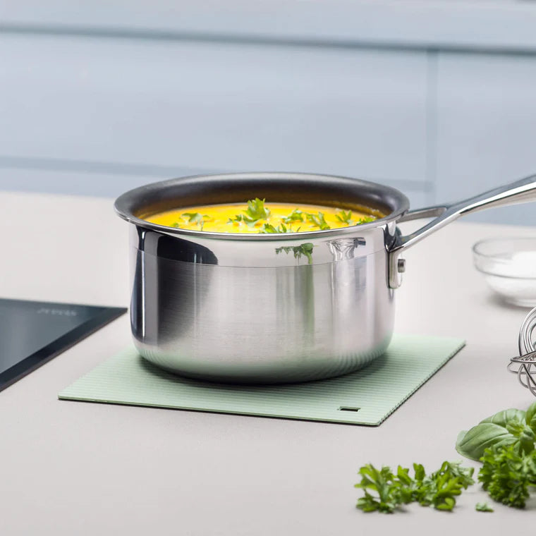 The Zeal Silicone Trivet Mat is the ultimate kitchen multitasker, protecting your countertops and tables from hot pots, pans, and dishes with its non-slip, heat-resistant design (up to 250ºC/482ºF). This 9" x 9" mat isn’t just for hot cookware—it doubles as a potholder, placemat, jar opener, or even a stabilizer for mixing bowls and cutting boards.